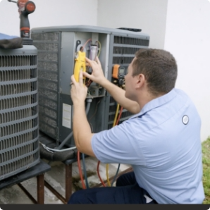 HVAC repair technician servicing an outdoor air conditioning unit.
